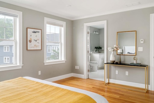 31 Neponset Ave, Boston, MA 02131 - bedroom with wood finished floors, crown molding, and ensuite bathroom