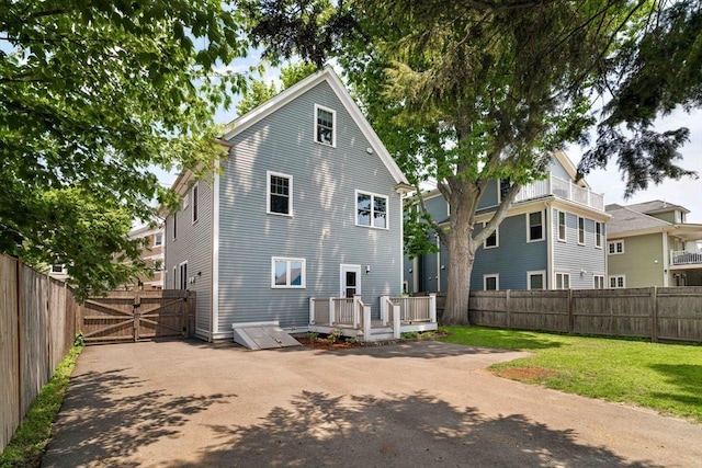 31 Neponset Ave, Boston, MA 02131 - rear view of property with a deck, a fenced backyard, and a gate