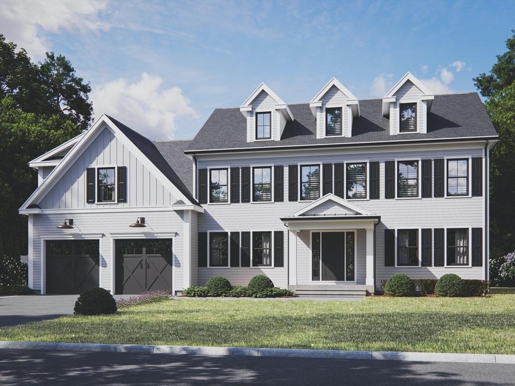 view of front of home featuring a garage and a front lawn