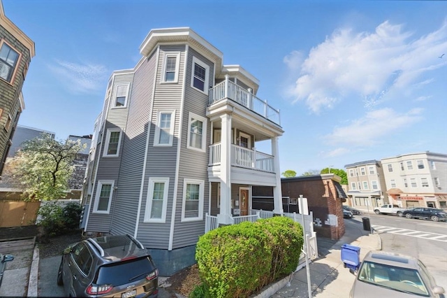 view of home's exterior featuring a balcony