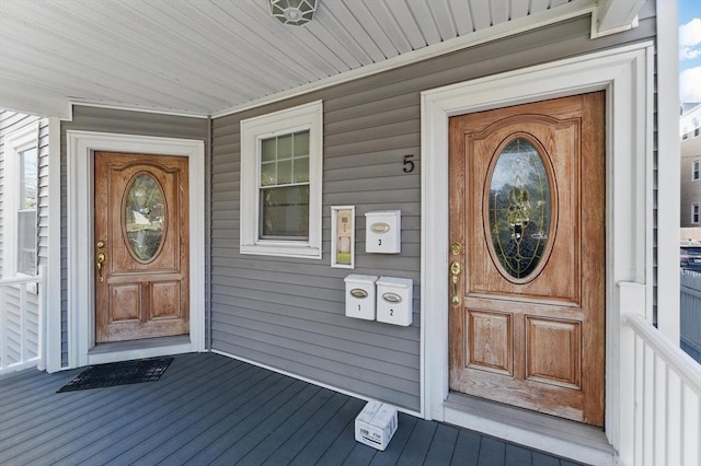 property entrance featuring covered porch