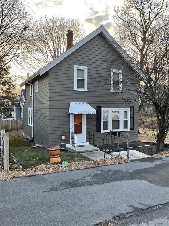 56 Riverview St, Dedham, MA 02026 - view of front of home featuring a chimney