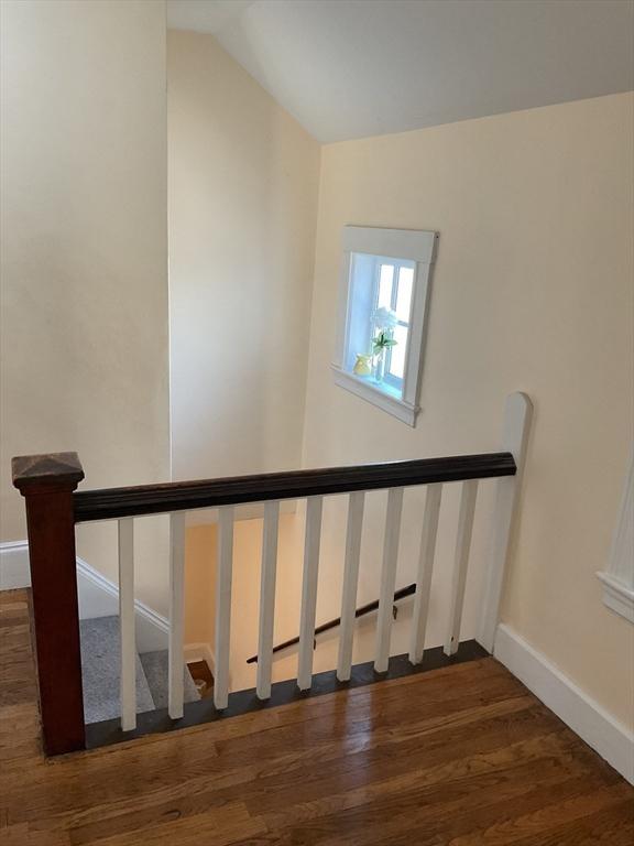 56 Riverview St, Dedham, MA 02026 - stairway featuring wood finished floors, baseboards, and vaulted ceiling