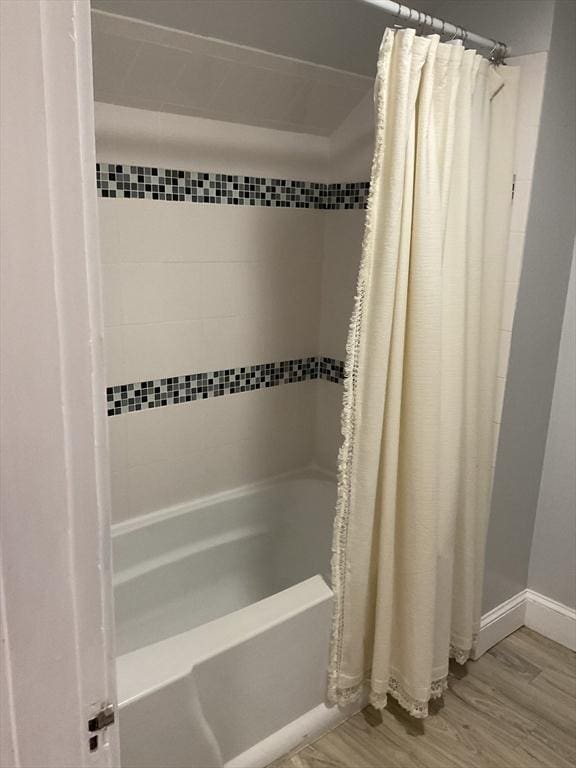 56 Riverview St, Dedham, MA 02026 - full bathroom with shower / tub combo, wood finished floors, and baseboards
