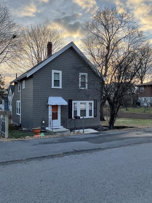 56 Riverview St, Dedham, MA 02026 - view of front of property featuring a chimney