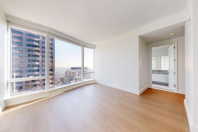 240 Devonshire St Unit 4012, Boston, MA 02110 - empty room with light wood-style flooring and baseboards