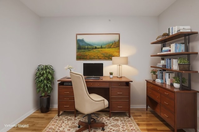 office space with light hardwood / wood-style flooring