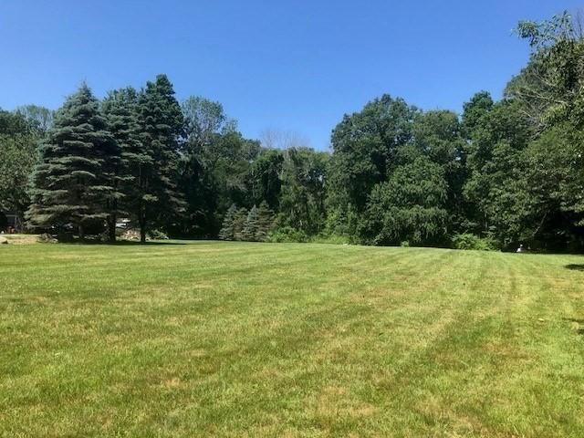 84 Booth Hill Rd, Scituate, MA 02066 - view of green lawn featuring a forest view