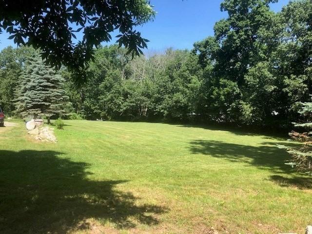 84 Booth Hill Rd, Scituate, MA 02066 - view of grassy yard featuring a forest view