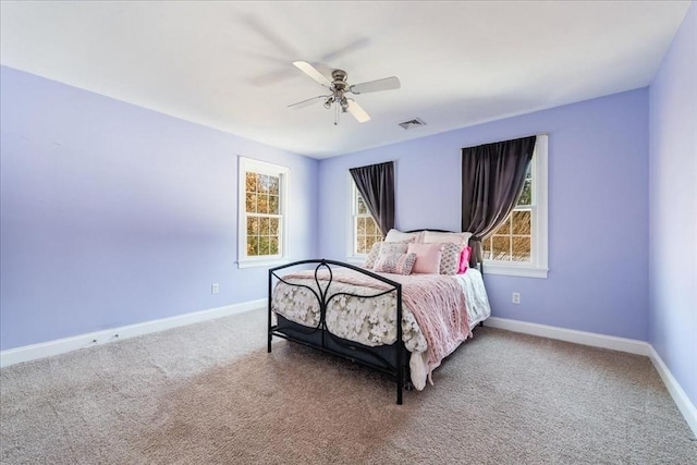 carpeted bedroom featuring ceiling fan