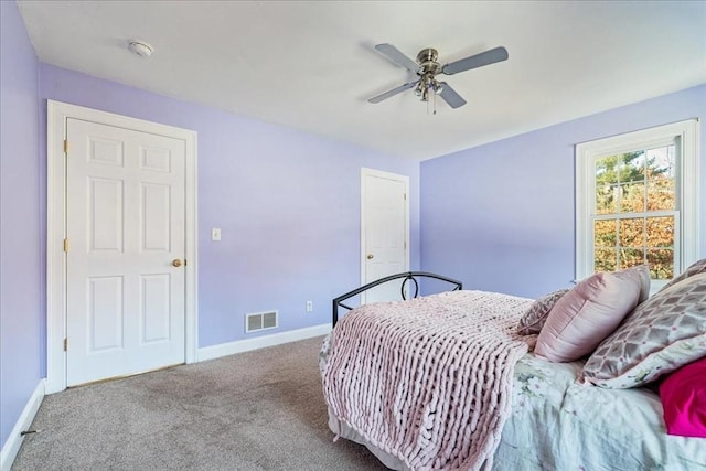 bedroom with ceiling fan and carpet