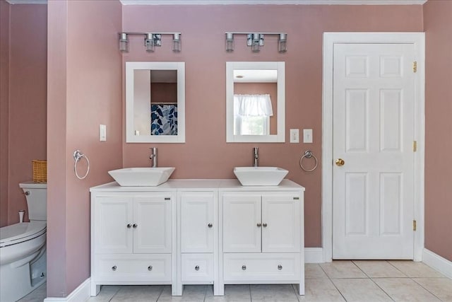 bathroom featuring tile patterned floors, vanity, and toilet