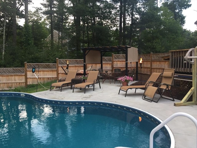 view of swimming pool featuring a patio