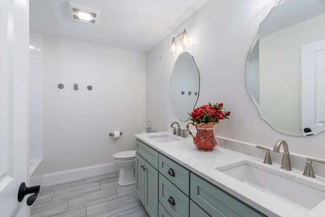 21 Bailey Pond Ln Unit 21, Amesbury, MA 01913 - bathroom with toilet, double vanity, a shower, baseboards, and a bathtub