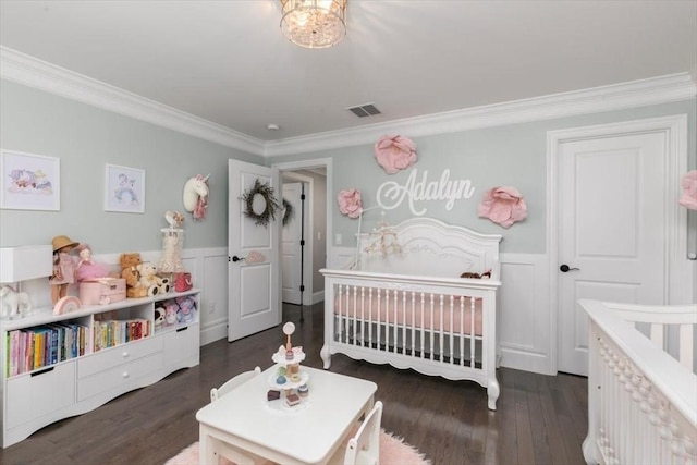 21 Bailey Pond Ln Unit 21, Amesbury, MA 01913 - bedroom featuring crown molding, a nursery area, wood finished floors, a wainscoted wall, and a decorative wall