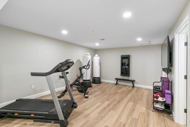 21 Bailey Pond Ln Unit 21, Amesbury, MA 01913 - workout room featuring light wood-style floors, baseboards, recessed lighting, and water heater