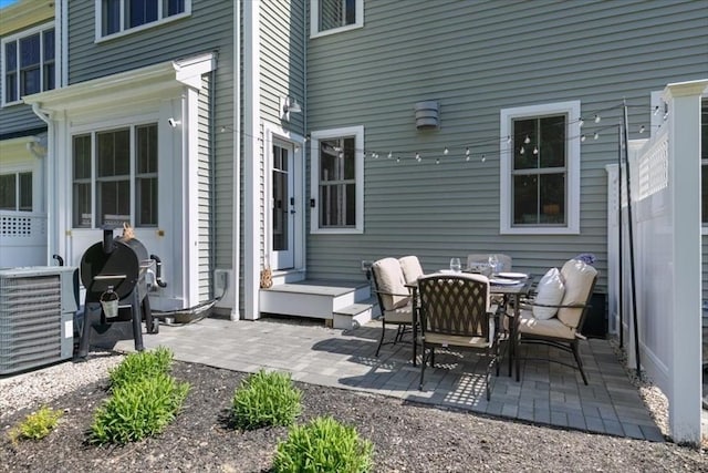 21 Bailey Pond Ln Unit 21, Amesbury, MA 01913 - view of patio with central air condition unit, outdoor dining area, and a grill
