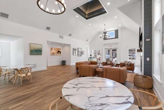 21 Bailey Pond Ln Unit 21, Amesbury, MA 01913 - dining area featuring a chandelier, wood finished floors, high vaulted ceiling, baseboards, and recessed lighting