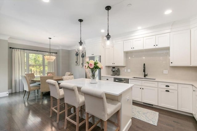 21 Bailey Pond Ln Unit 21, Amesbury, MA 01913 - kitchen with a sink, ornamental molding, dishwasher, backsplash, and light countertops