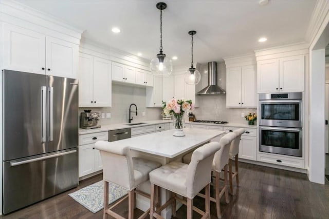21 Bailey Pond Ln Unit 21, Amesbury, MA 01913 - kitchen featuring appliances with stainless steel finishes, wall chimney range hood, a sink, white cabinetry, and light countertops