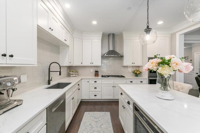 21 Bailey Pond Ln Unit 21, Amesbury, MA 01913 - kitchen featuring wall chimney range hood, a sink, stainless steel dishwasher, gas stovetop, and white cabinetry