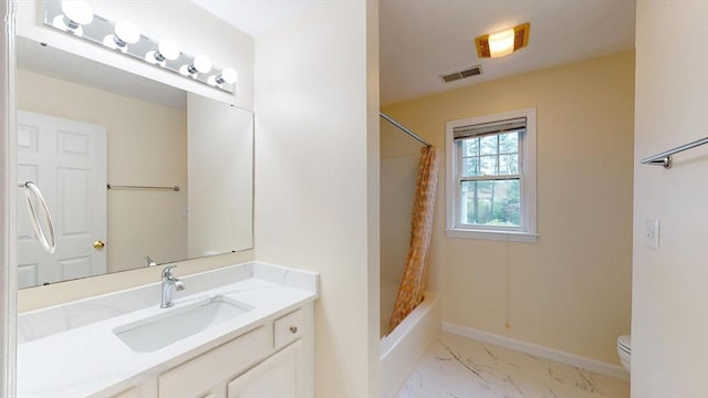 bathroom with marble look tiles, toilet, vanity, baseboards, and shower / bath combo with shower curtain