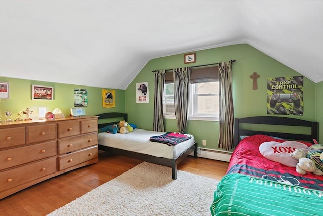 2 Woodbrier Rd, Topsfield, MA 01983 - bedroom featuring wood finished floors, vaulted ceiling, and a baseboard heating unit
