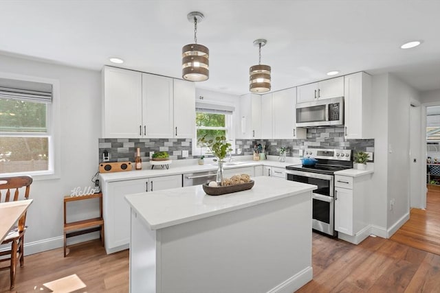 2 Woodbrier Rd, Topsfield, MA 01983 - kitchen featuring appliances with stainless steel finishes, tasteful backsplash, baseboards, white cabinets, and recessed lighting