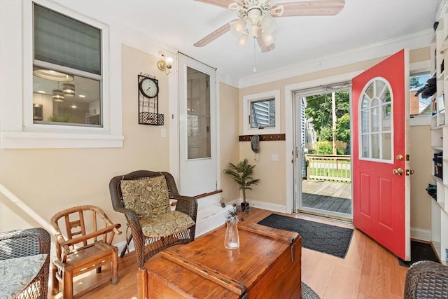 2 Woodbrier Rd, Topsfield, MA 01983 - entryway featuring wood finished floors, baseboards, ornamental molding, and ceiling fan