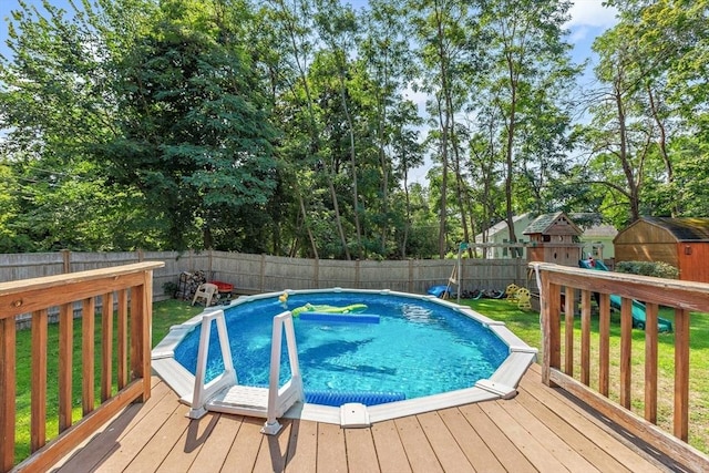 2 Woodbrier Rd, Topsfield, MA 01983 - view of swimming pool with a wooden deck, a shed, and an outdoor structure