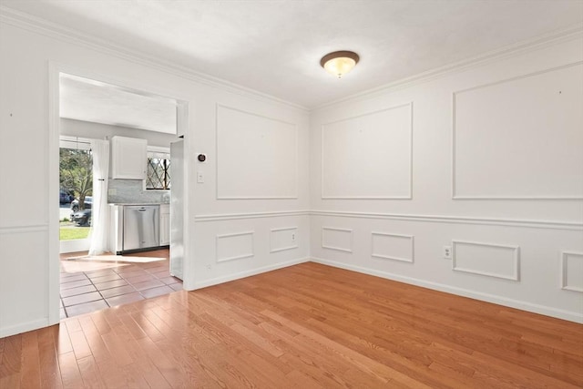 246 Farrwood Dr Unit 246, Haverhill, MA 01835 - spare room with light wood finished floors and crown molding