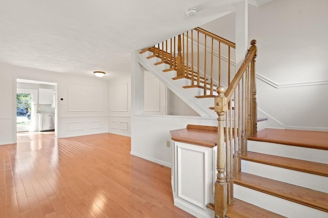 246 Farrwood Dr Unit 246, Haverhill, MA 01835 - stairs with wood finished floors and a decorative wall