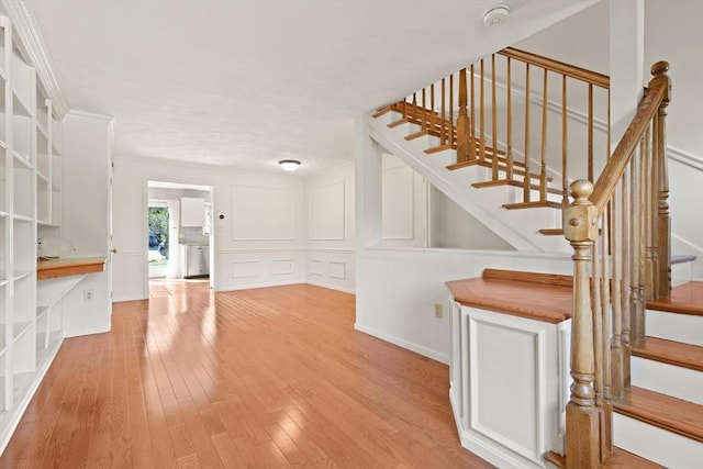 246 Farrwood Dr Unit 246, Haverhill, MA 01835 - stairway featuring hardwood / wood-style flooring and a decorative wall