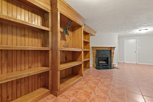 246 Farrwood Dr Unit 246, Haverhill, MA 01835 - unfurnished living room with a high end fireplace, tile patterned floors, and a textured ceiling