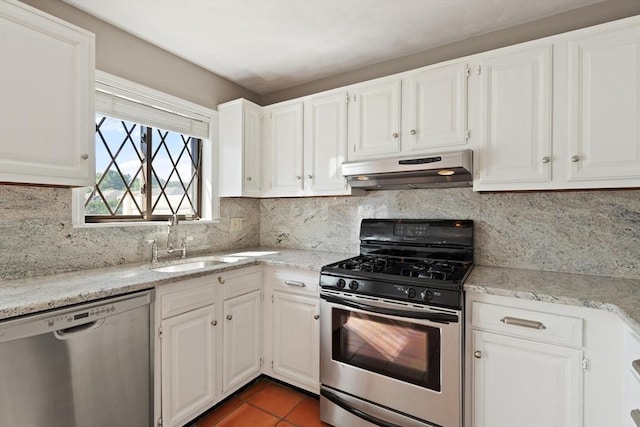 246 Farrwood Dr Unit 246, Haverhill, MA 01835 - kitchen with appliances with stainless steel finishes, under cabinet range hood, white cabinets, tasteful backsplash, and tile patterned flooring