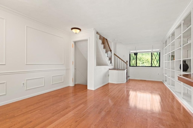 246 Farrwood Dr Unit 246, Haverhill, MA 01835 - spare room featuring light wood-style flooring, stairway, and ornamental molding