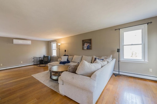 living room featuring a baseboard heating unit, radiator heating unit, light wood-style flooring, a wall mounted AC, and a baseboard radiator