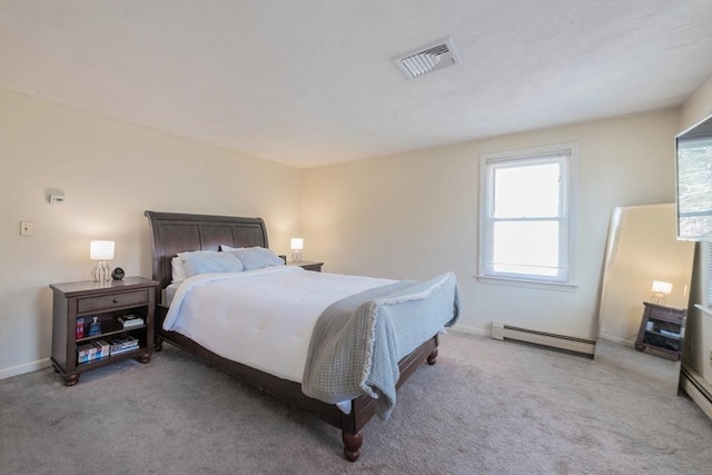 carpeted bedroom featuring baseboards, visible vents, and a baseboard radiator