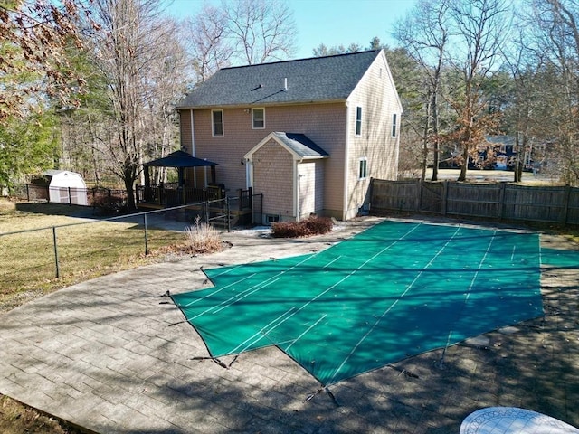 view of swimming pool featuring a fenced backyard