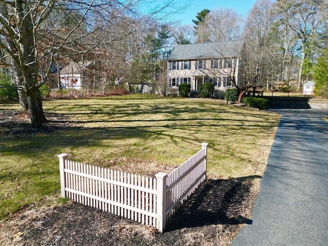 exterior space with a yard and fence