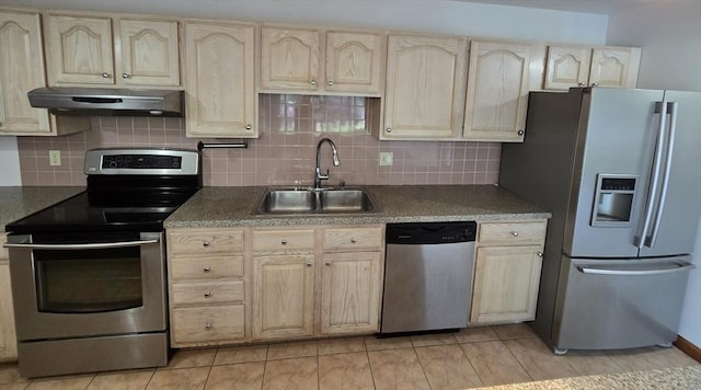 17 Skyline Dr Unit 3, Braintree, MA 02184 - kitchen with stainless steel appliances, under cabinet range hood, backsplash, and light tile patterned floors