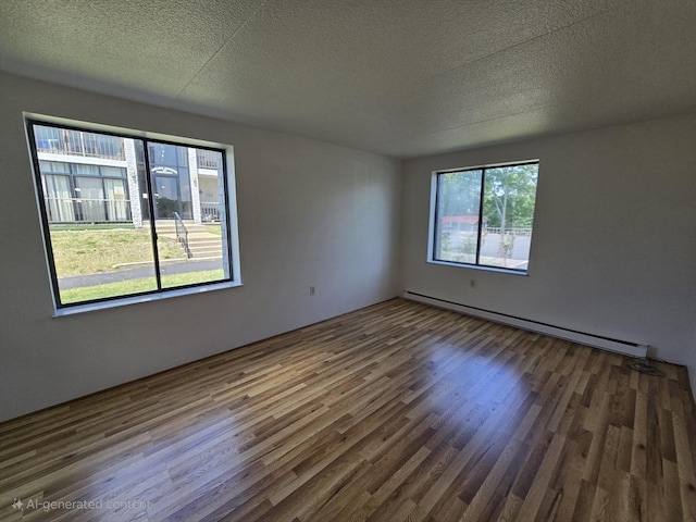 17 Skyline Dr Unit 3, Braintree, MA 02184 - empty room featuring baseboard heating, wood finished floors, and a textured ceiling