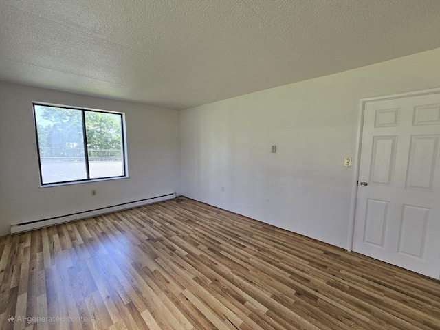 17 Skyline Dr Unit 3, Braintree, MA 02184 - empty room with baseboard heating, wood finished floors, and a textured ceiling