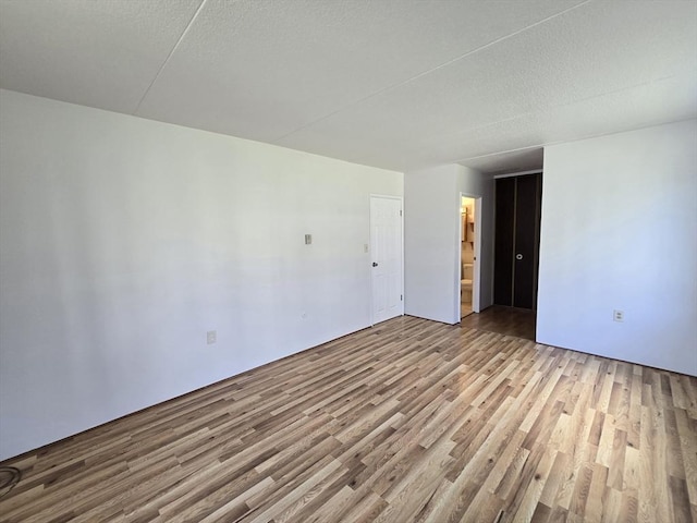 17 Skyline Dr Unit 3, Braintree, MA 02184 - empty room with wood finished floors and a textured ceiling