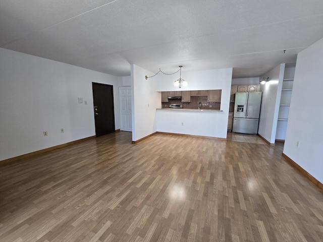 17 Skyline Dr Unit 3, Braintree, MA 02184 - unfurnished living room featuring dark wood-style flooring and baseboards