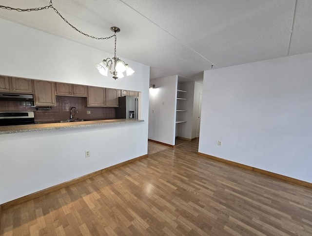 17 Skyline Dr Unit 3, Braintree, MA 02184 - kitchen with stainless steel fridge with ice dispenser, range, under cabinet range hood, a chandelier, and wood finished floors