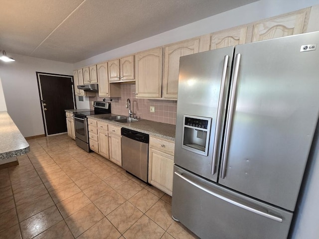 17 Skyline Dr Unit 3, Braintree, MA 02184 - kitchen featuring stainless steel appliances, under cabinet range hood, light brown cabinets, backsplash, and light tile patterned floors