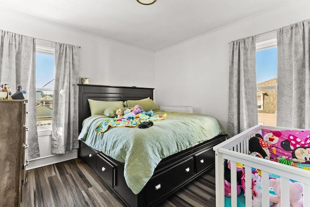 bedroom with wood finished floors