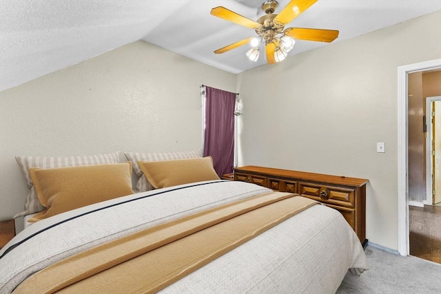 bedroom featuring carpet floors, ceiling fan, and lofted ceiling