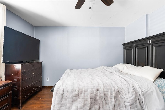 bedroom with dark wood-style floors and a ceiling fan